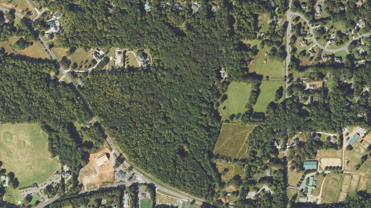 Aerial view of the wooded land at the Arnold Mill and New Providence crossroads in Milton